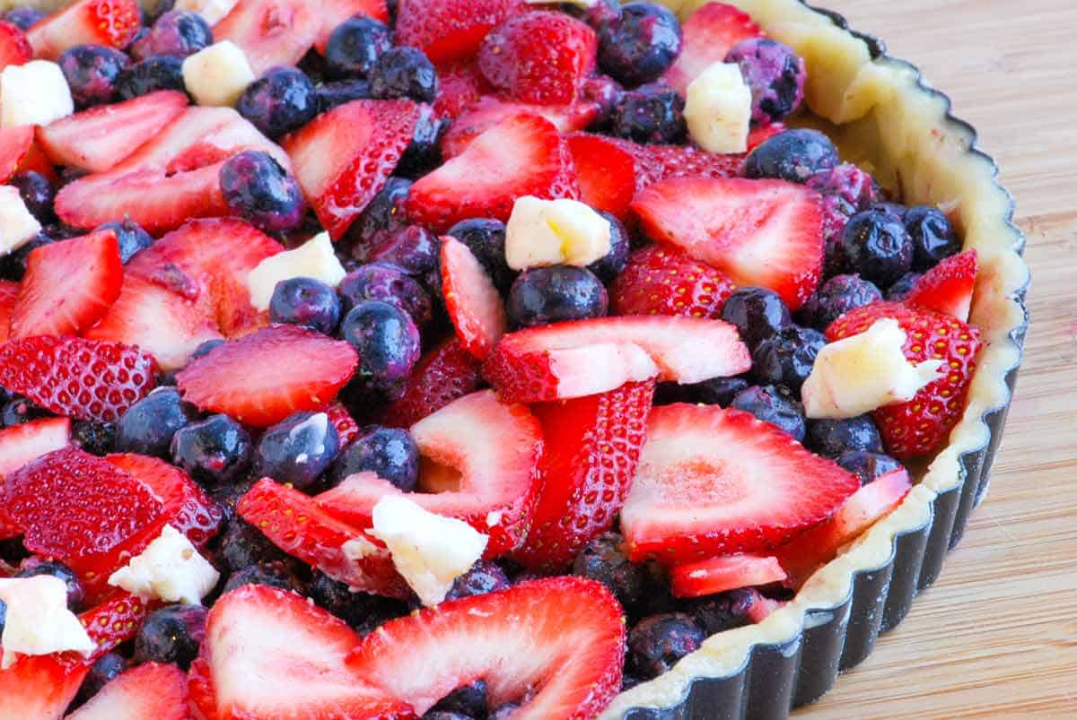 Simple Blueberry and Strawberry Tart Recipe Berry Tart ready to bake in the oven.