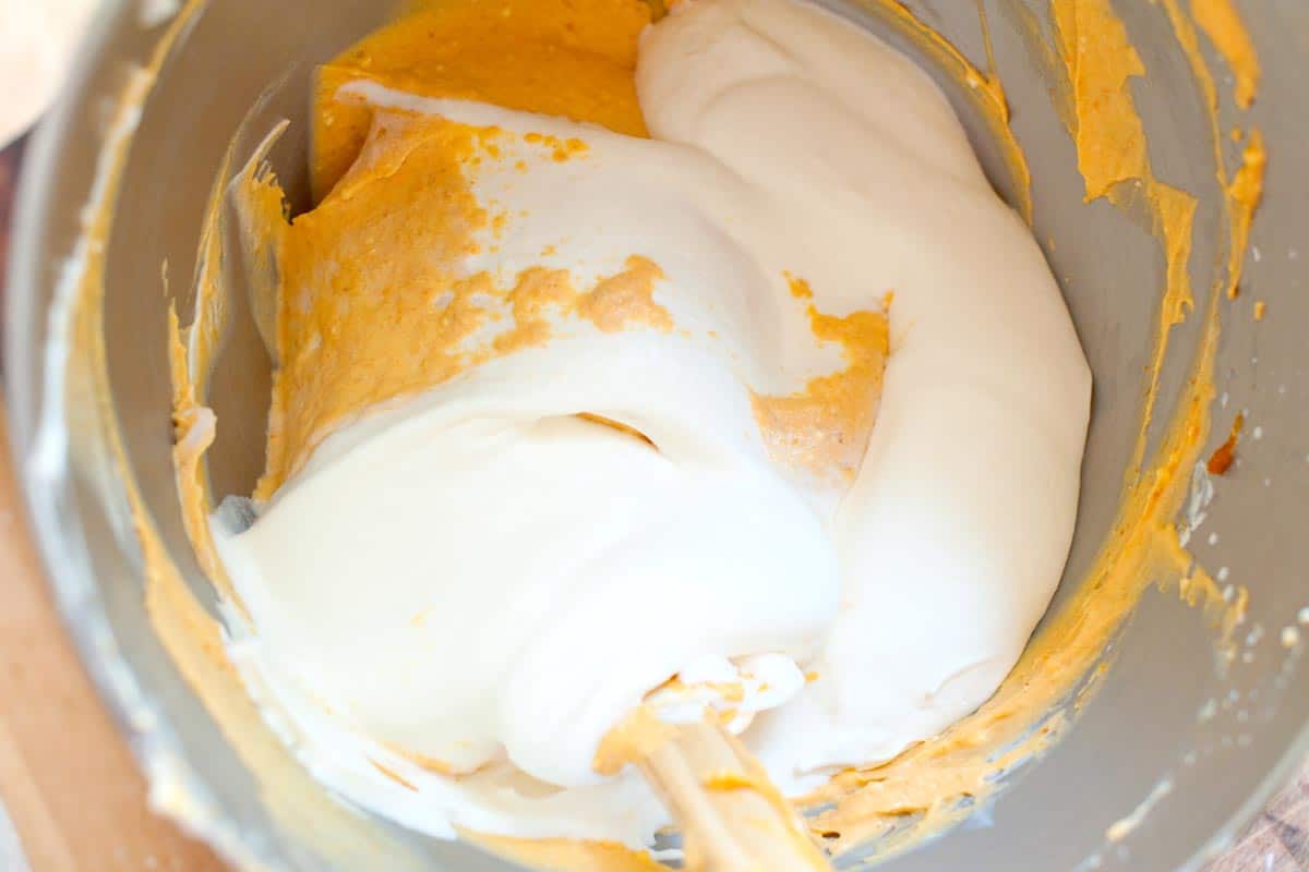Folding the whipped cream into pumpkin cream cheese for pumpkin mousse