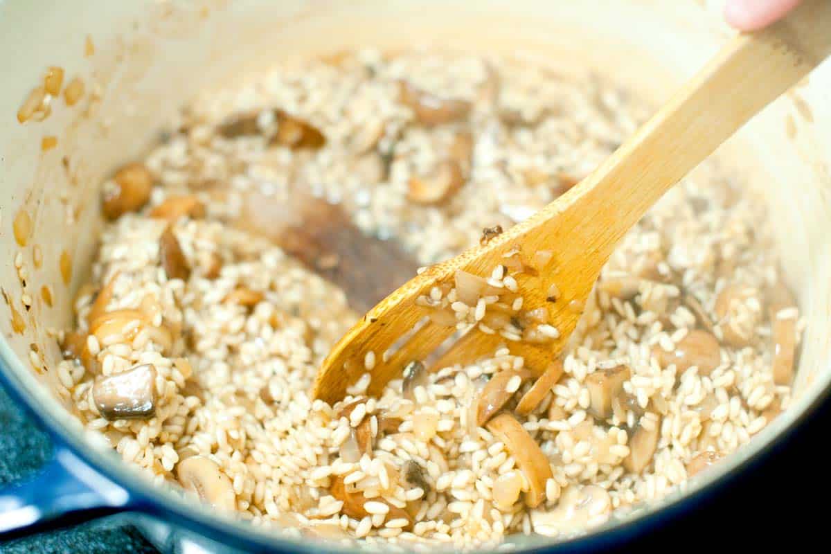 Ultra Creamy Mushroom Risotto Recipe How to Make Mushroom Risotto: Stirring risotto to make it creamy