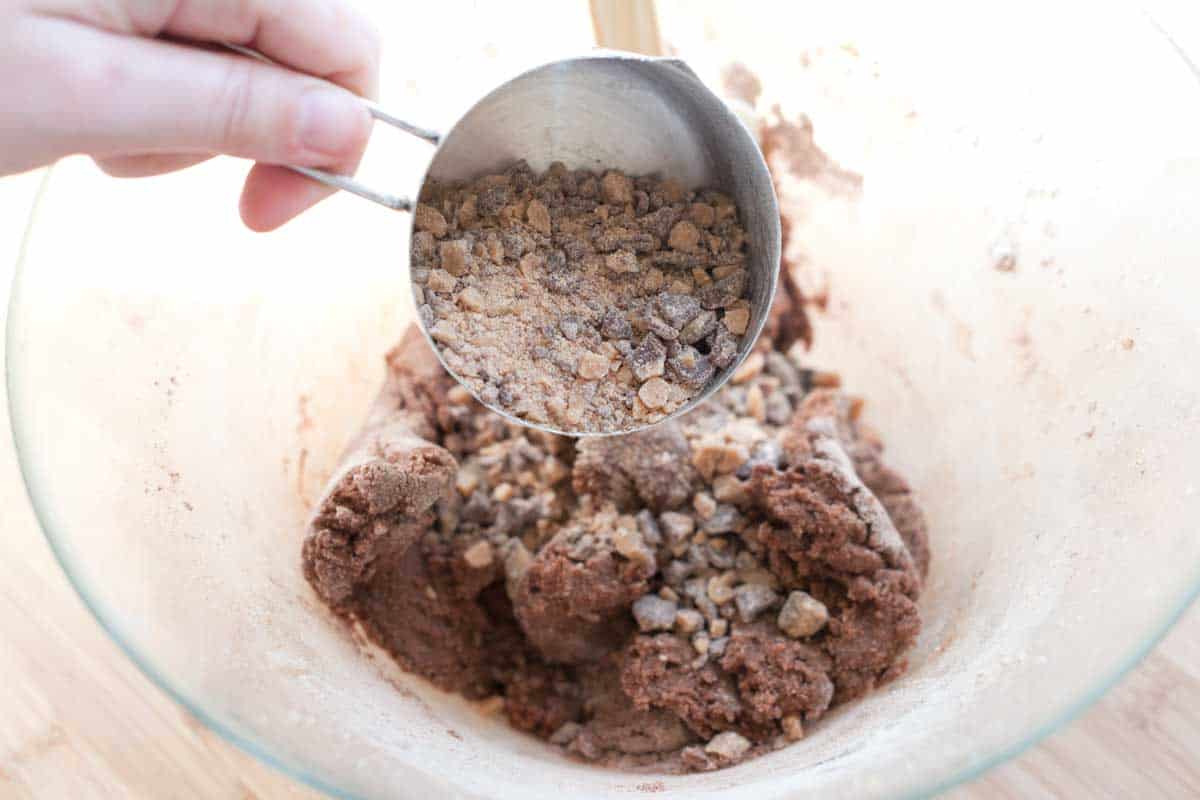 Adding the toffee bits to the cookie dough
