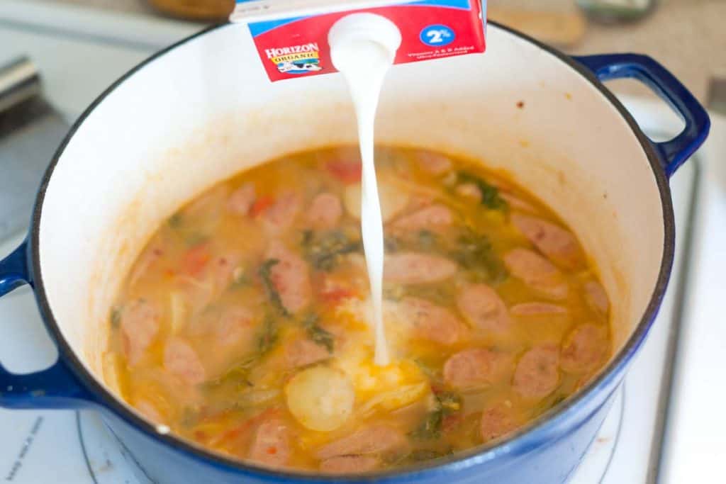 Adding cream to chicken sausage soup