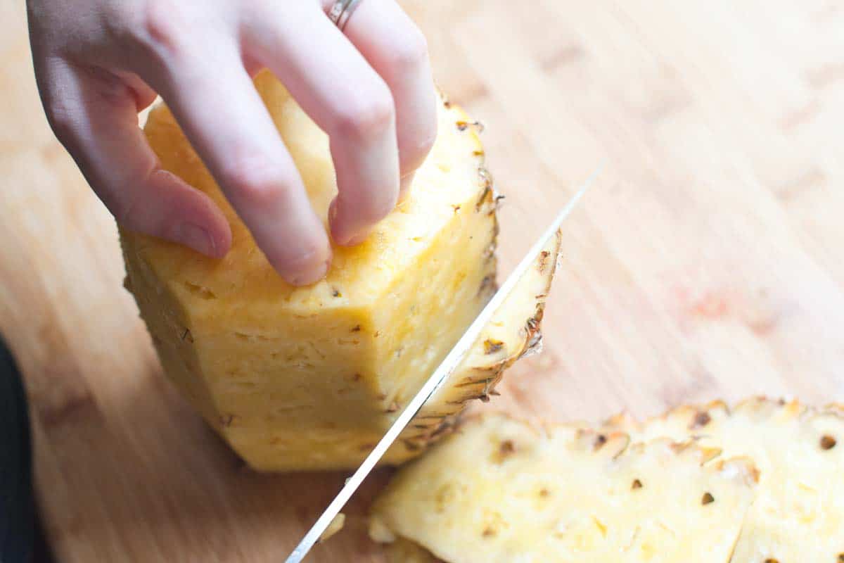 How to cut a pineapple for salsa - Removing the peel