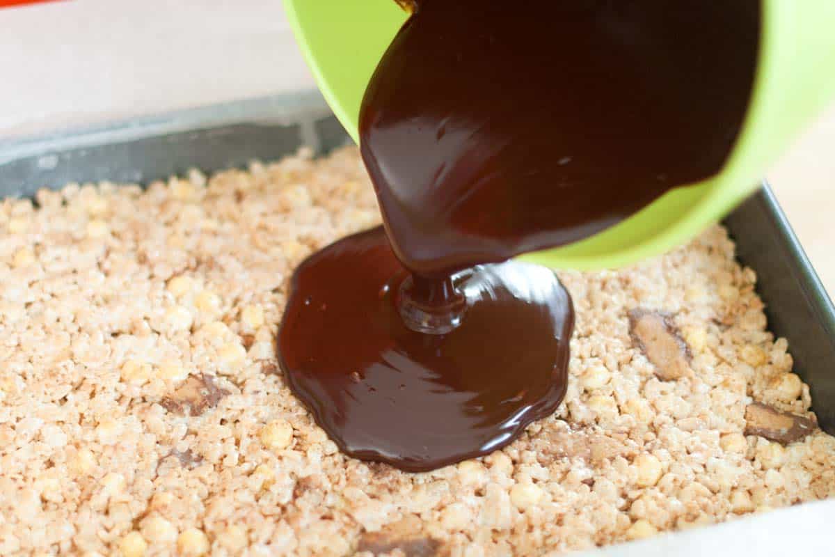Chocolate Covered Reese's Rice Krispie Treats Adding the chocolate glaze