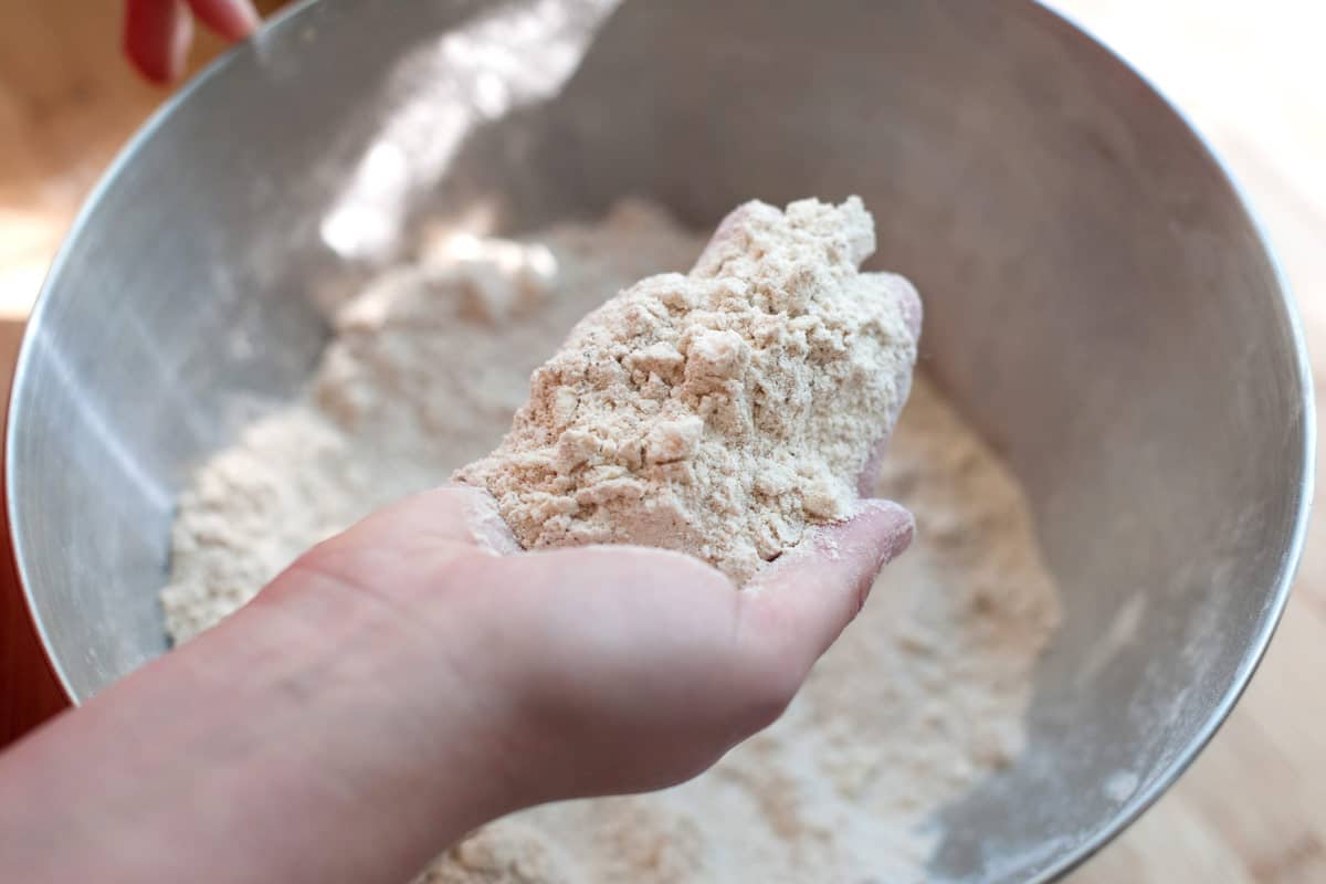 Cutting cold butter into flour.