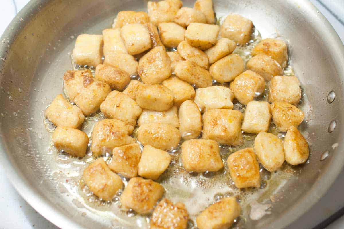 Cooking gnocchi dumplings in melted butter