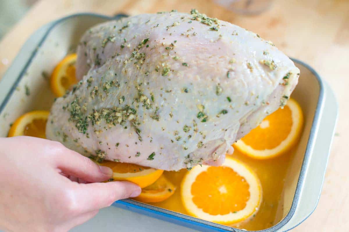 Preparing bone-in turkey breast for roasting.