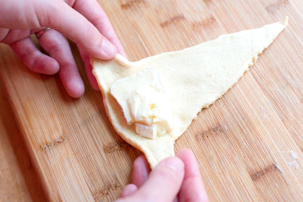How to Make Baked Brie Crescent Rolls: Rolling up the cheese
