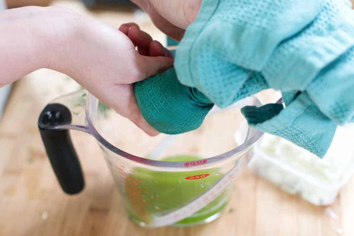How to Make Feta Tzatziki: Squeeze out the extra moisture from cucumbers