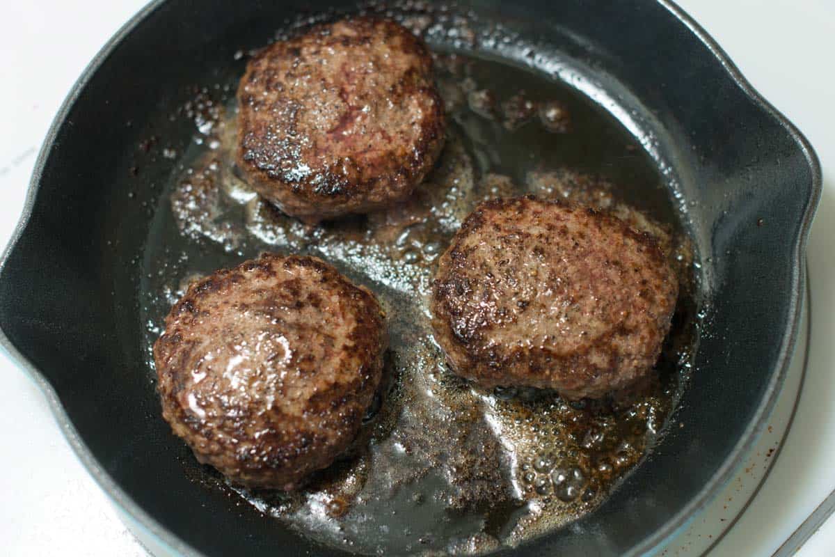 Cooking burgers in a Cast Iron Skillet