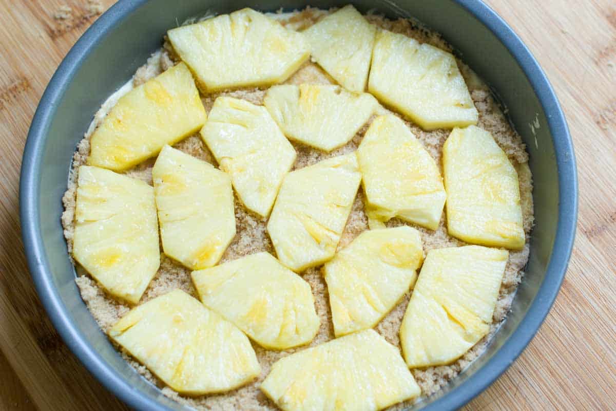 Use Fresh Pineapple for the Best Upside Down Pineapple Cake A layer of fresh pineapple and brown sugar on the bottom of the cake pan.