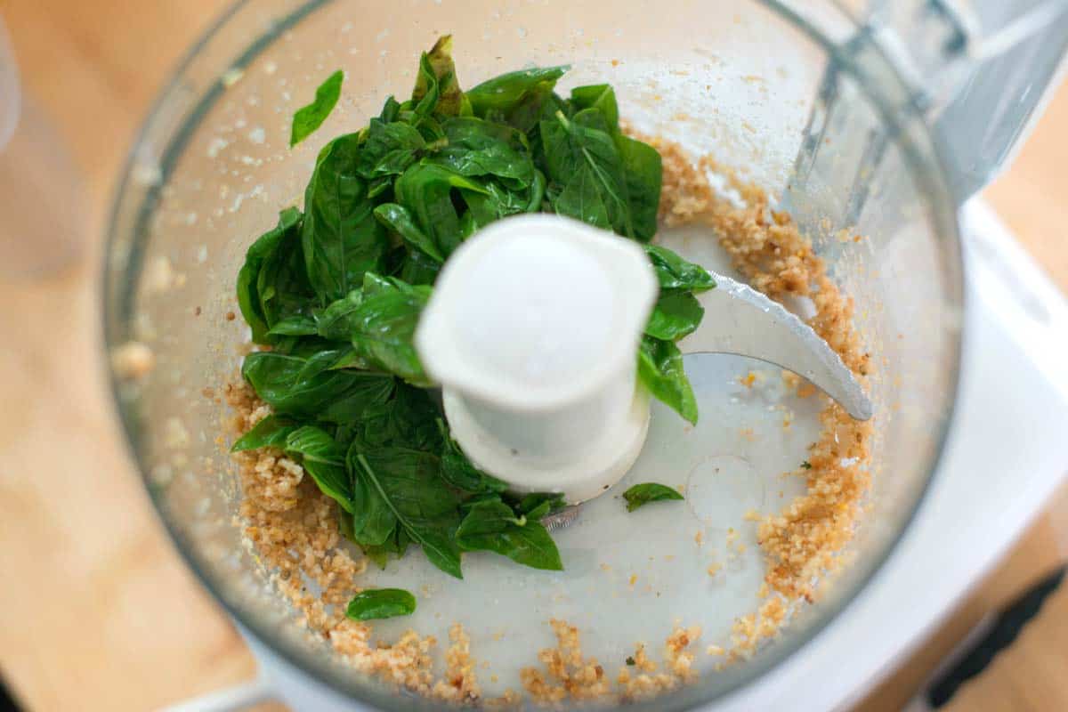 How to Make Pesto Basil in a food processor with pine nuts and garlic. (The basil is blanched)