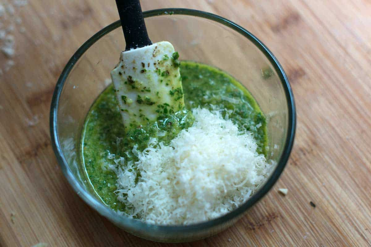 Stirring parmesan cheese into the pesto at the end to keep some texture.