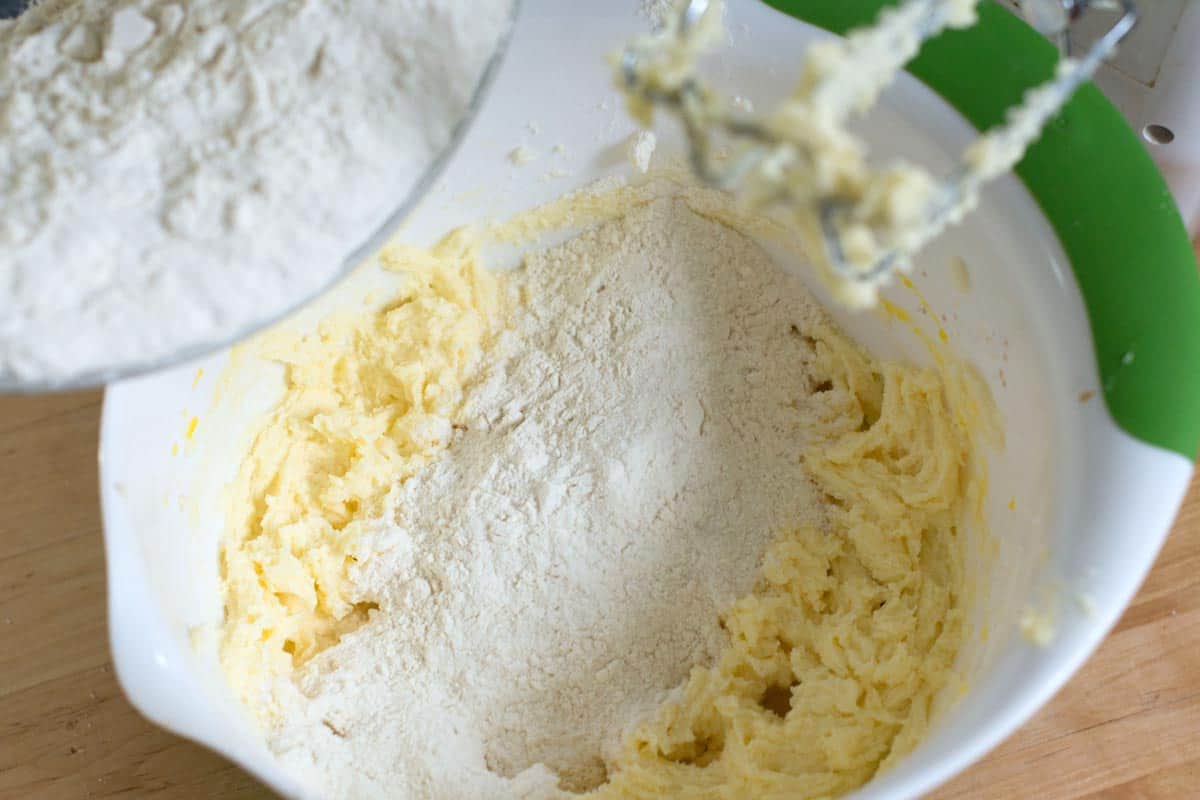 Adding flour to the snickerdoodle dough