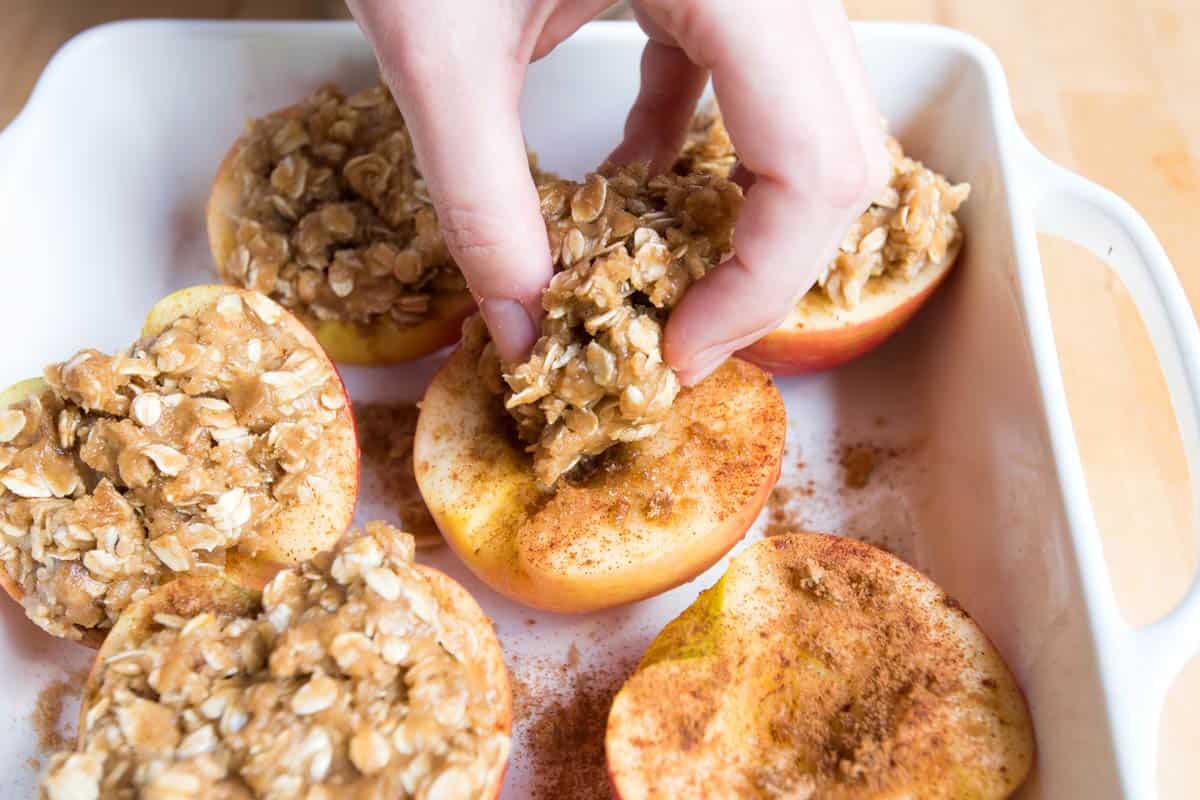 Adding the oat topping to the apples