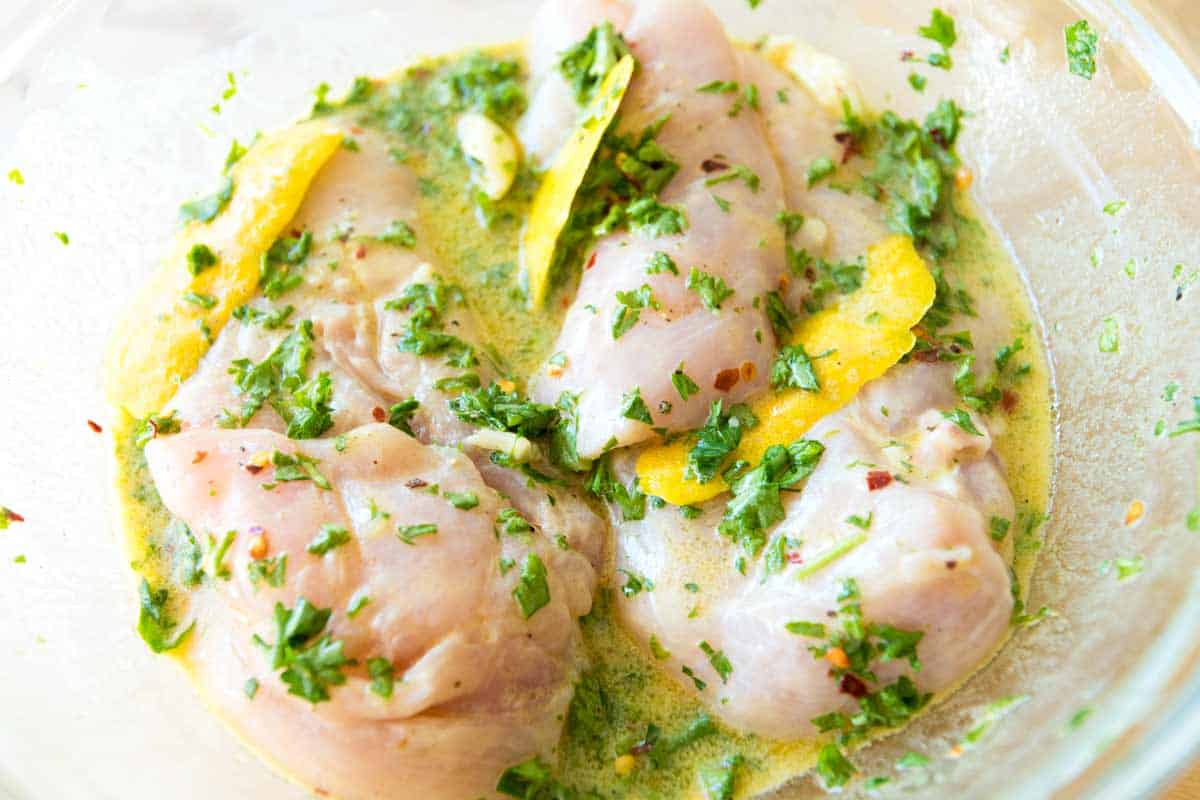 Marinating the chicken breasts in a lemon marinade