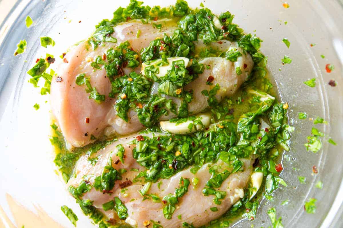 Marinating the chicken in basil vinaigrette