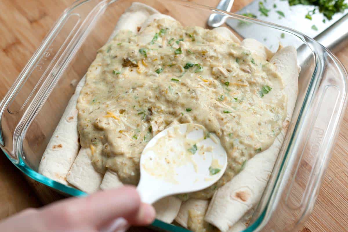 Assembling chicken enchiladas
