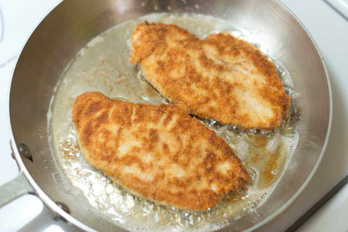 Pan frying breaded chicken cutlets for a golden brown crust