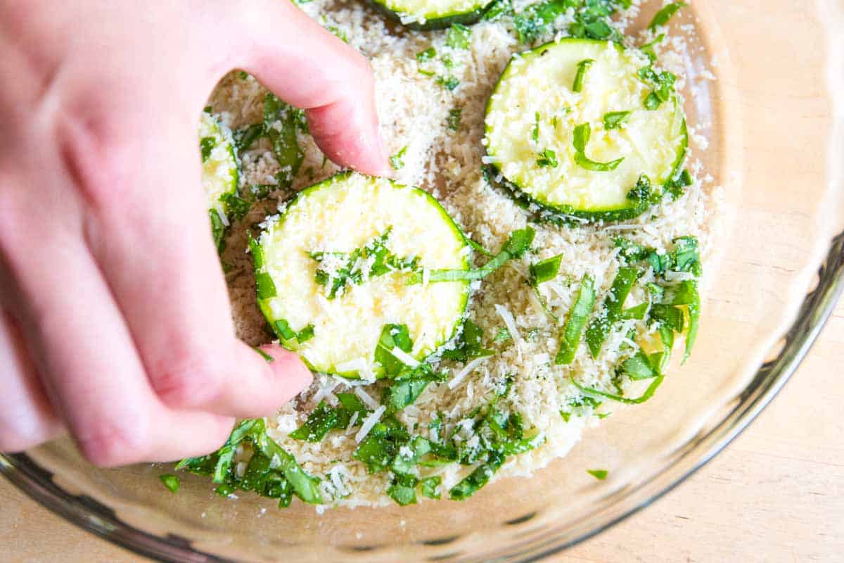 Adding the breading to zucchini coins to make chips