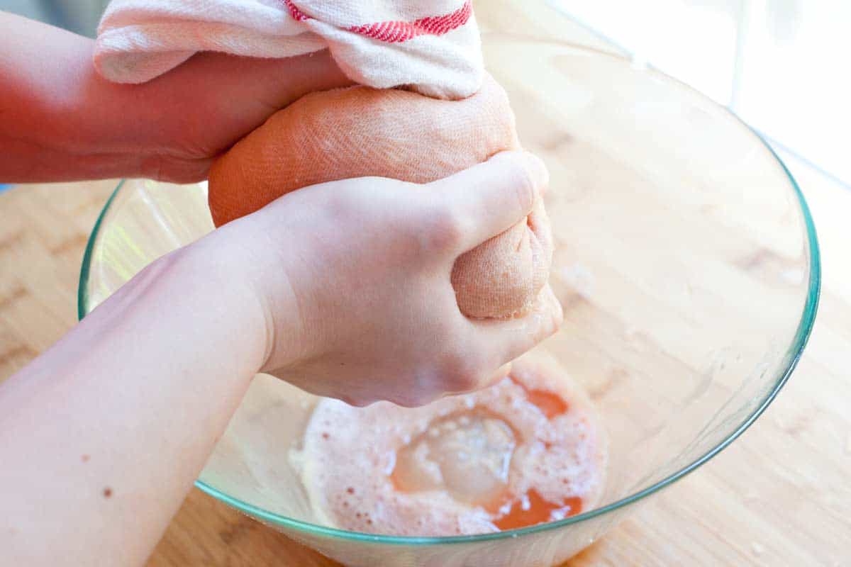 Squeezing out extra moisture from shredded potatoes