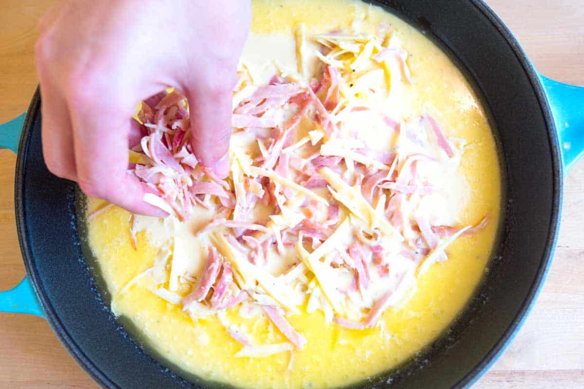 Ham and Cheese Dutch Baby Pancake Recipe Adding the ham and cheese to the pancake before baking in the oven