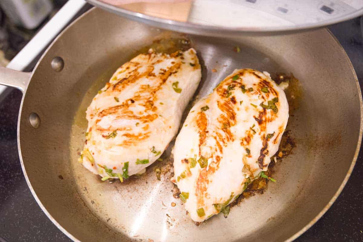 Cooking the chicken in a skillet with a lid before adding to the salad