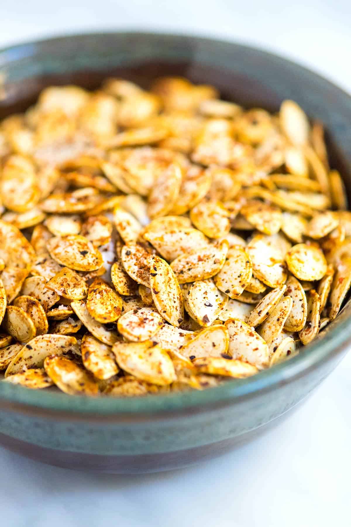 How to make the best roasted pumpkin seeds at home. You can even use this method for other winter squashes like butternut squash. Roasted Pumpkin Seeds