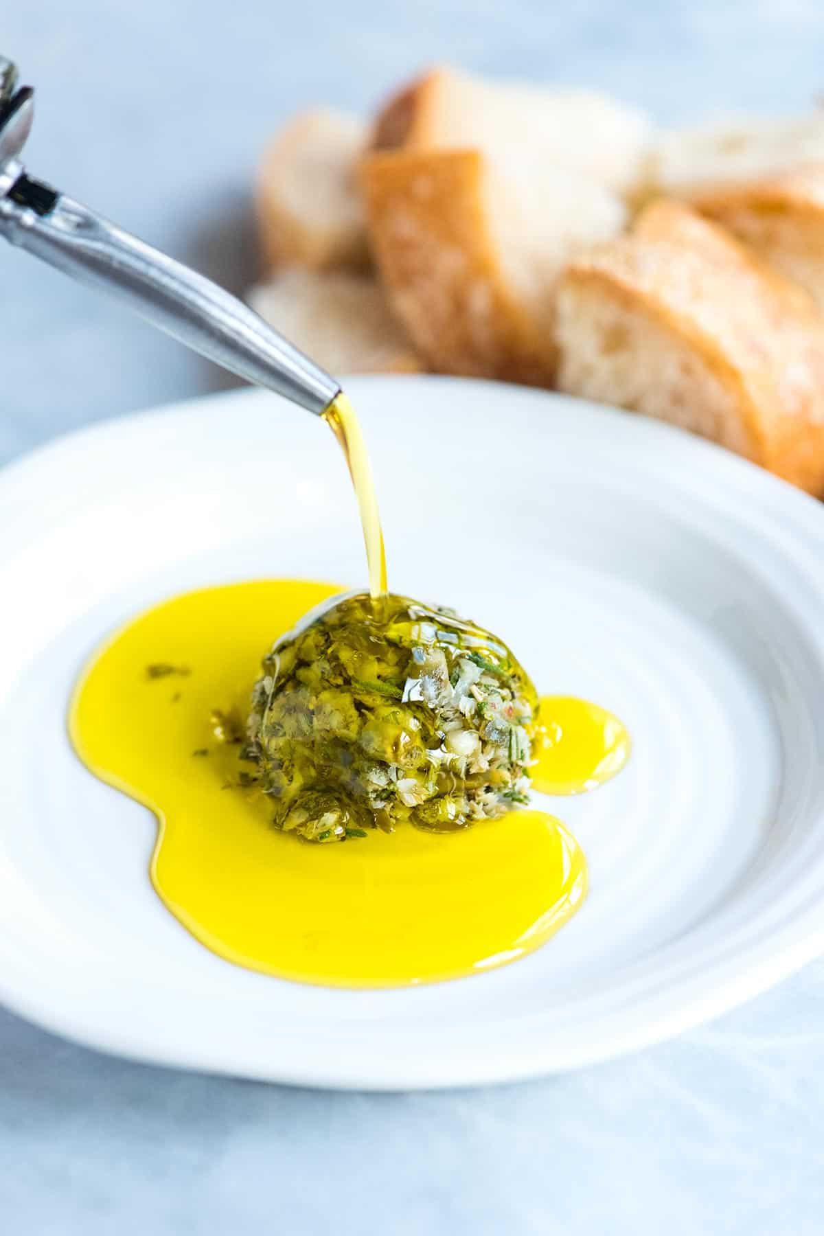 This easy and group-friendly olive oil dip comes together really quickly and it never fails. I mean, who doesn’t want to dip bread into an herby, garlicky, parmesan cheese infused olive oil? Olive Oil Bread Dip