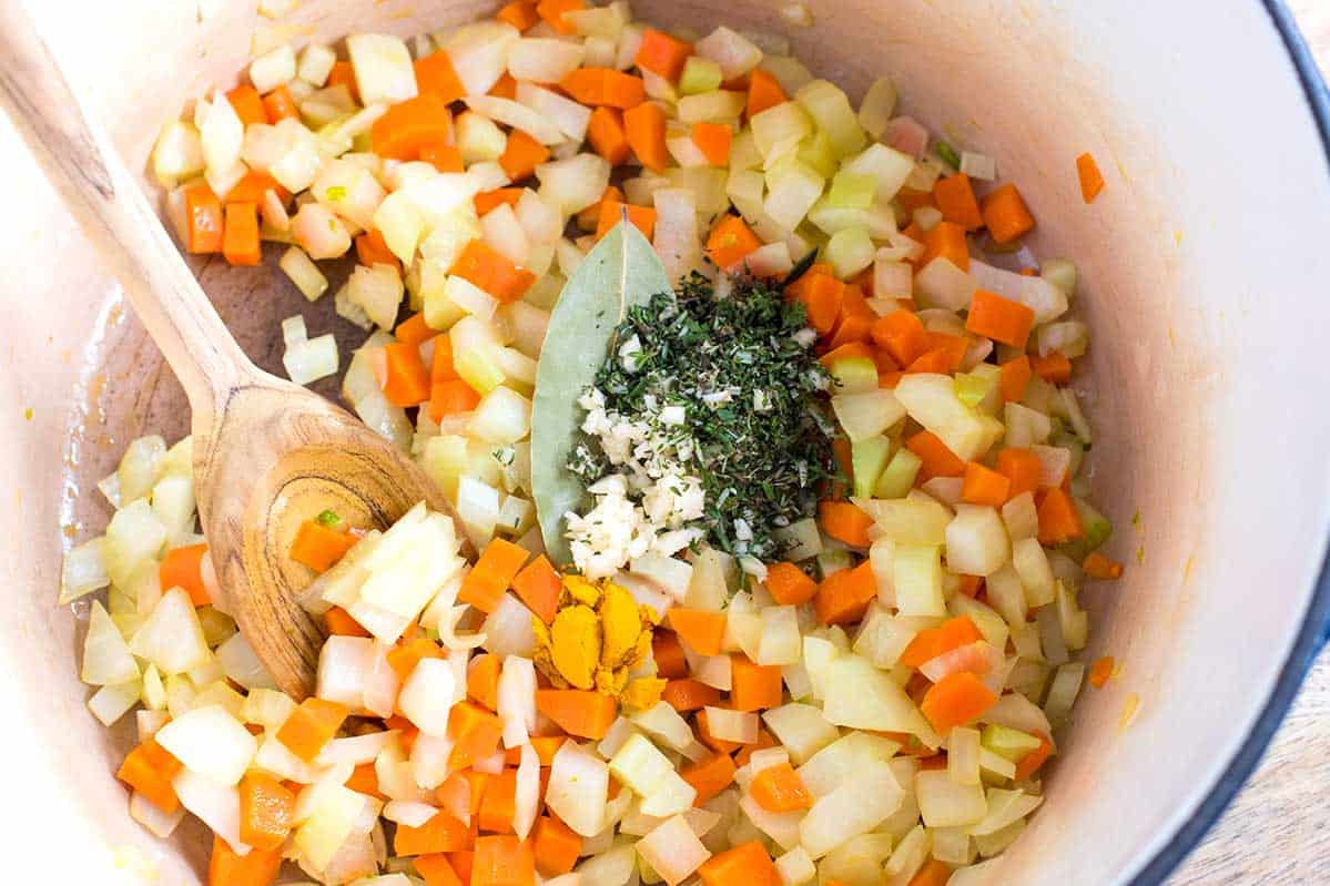 Cooking carrot, onion, and fennel for the base of chicken and vegetable soup