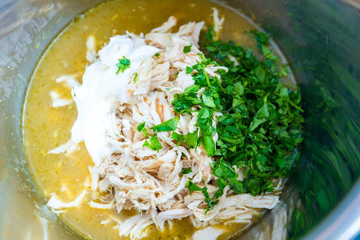Shredded chicken in the Instant Pot with cilantro and sour cream