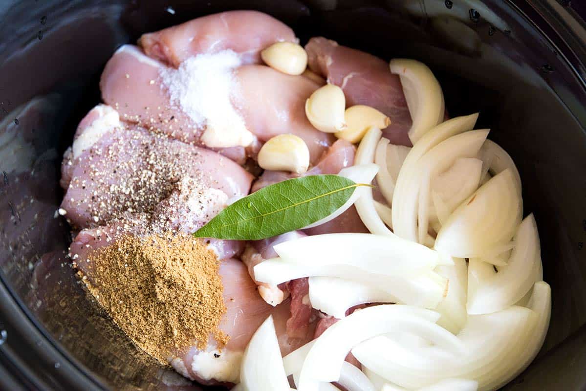 Slow cooker shredded chicken ingredients in a crockpot