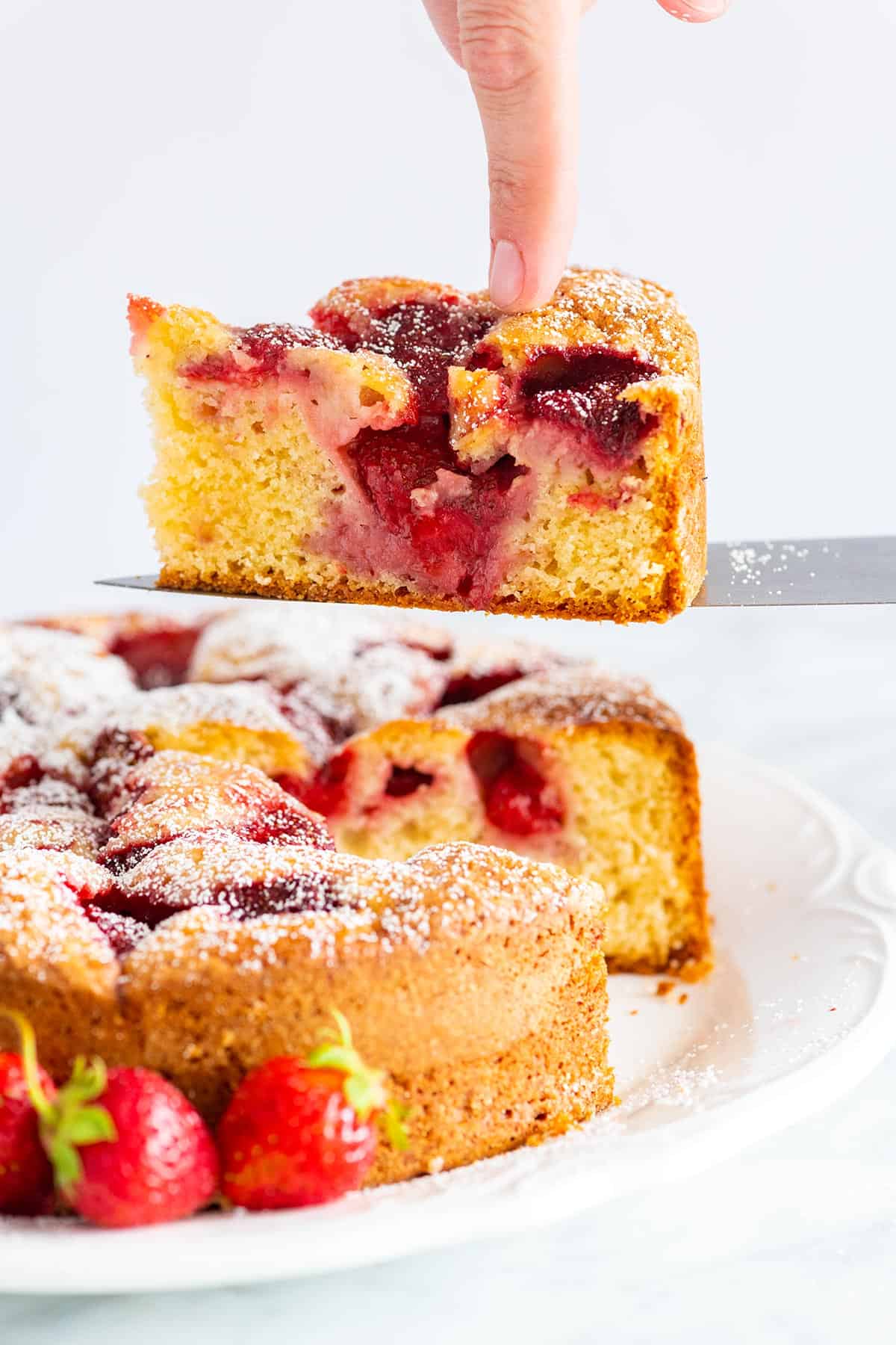 Stunning fresh strawberry cake recipe that’s extremely simple to make. The batter is made in one bowl! So easy. Homemade Fresh Strawberry Cake
