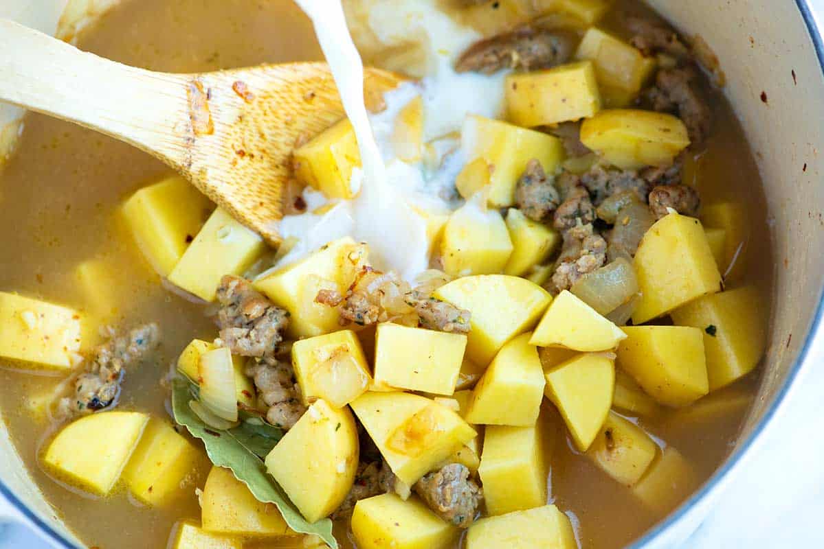 How to Make the Best Sausage and Potato Soup How to Make Sausage Potato Soup: Adding the broth to the potatoes and sausage
