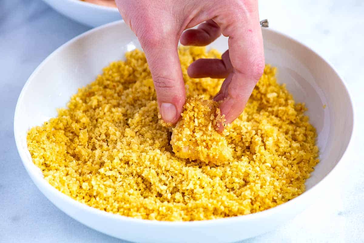 Breading chicken nuggets in crushed potato chips