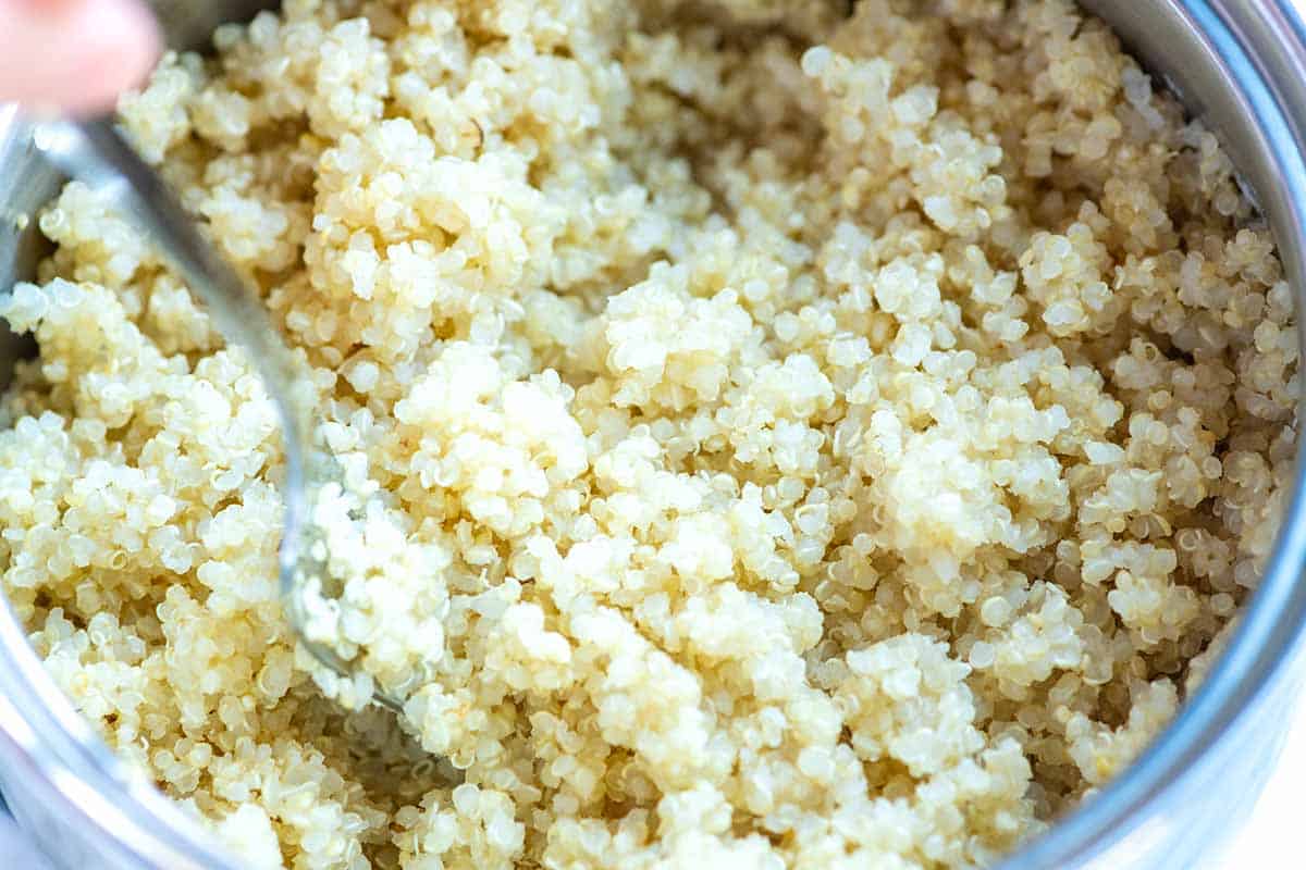 Fluffing cooked quinoa on with a fork
