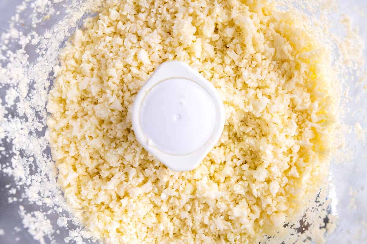 Making cauliflower rice in a food processor.