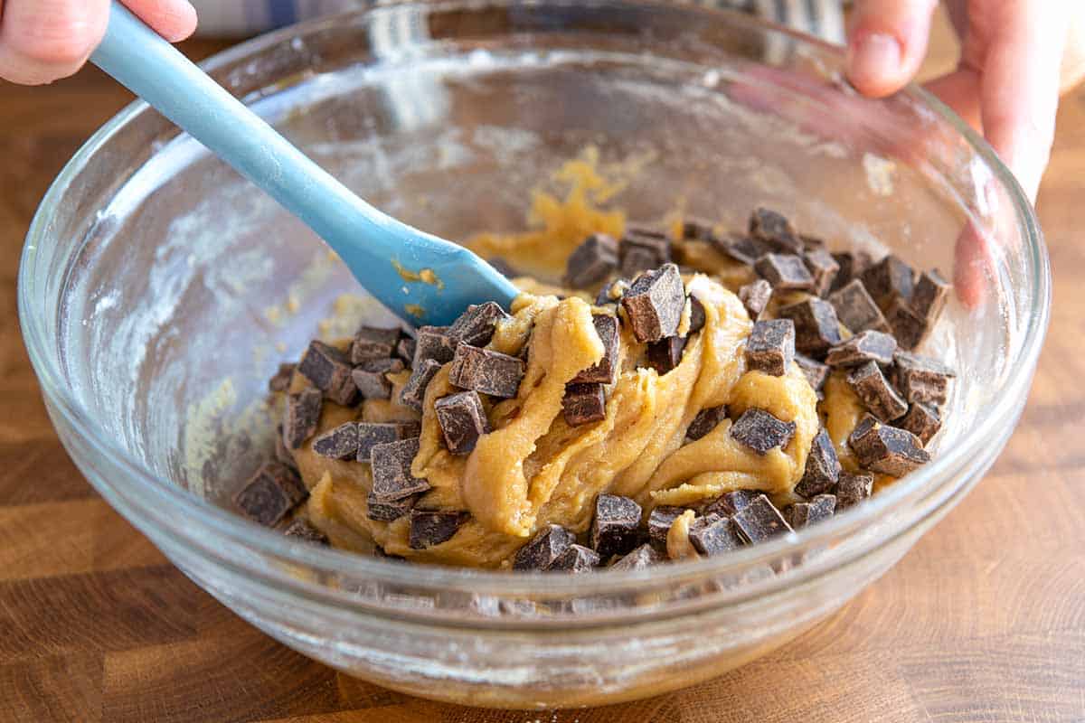 Adding the chocolate chips to the cookie dough