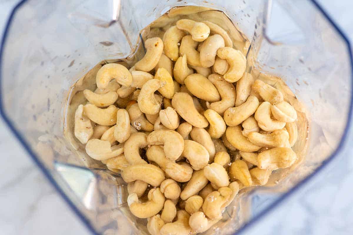 Cashews and hot water inside a blender