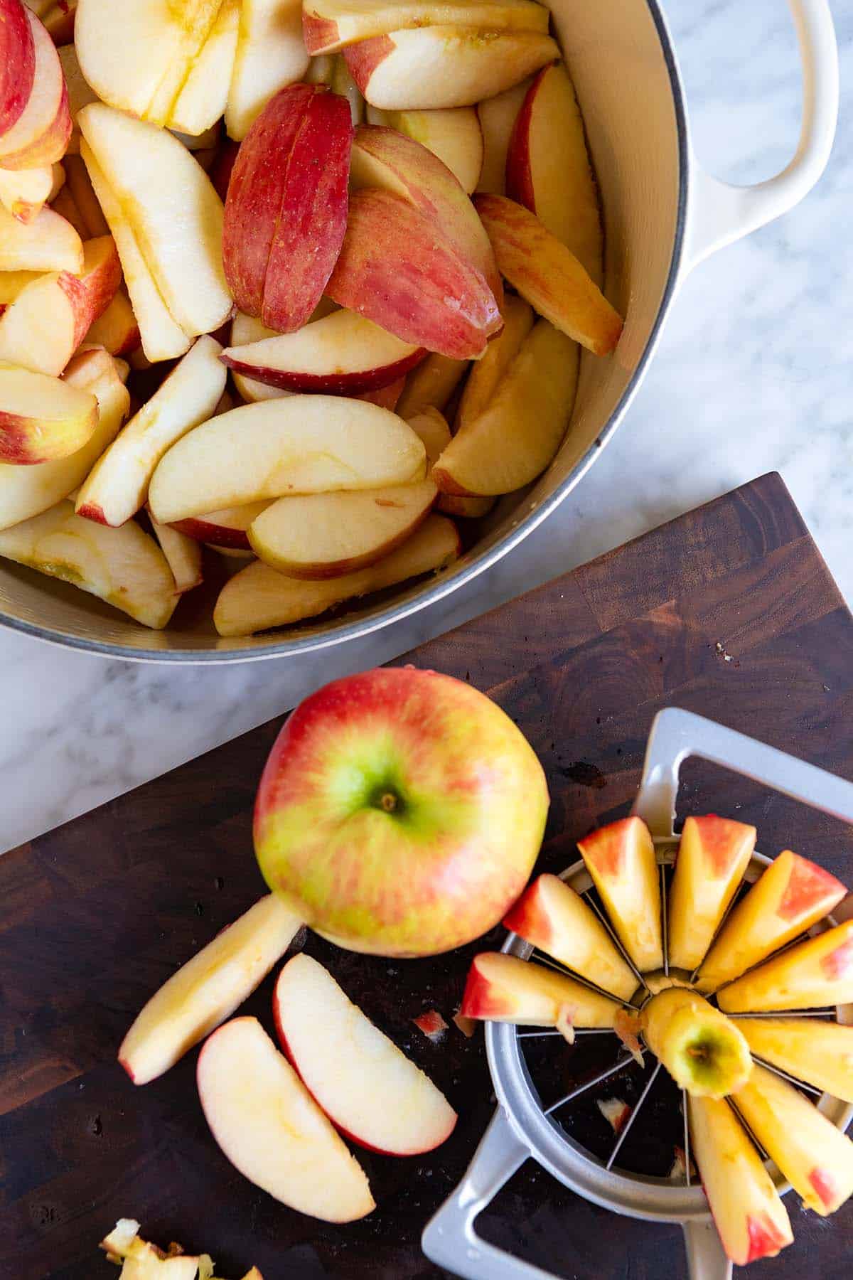 Apples cut into wedges ready for making applesauce.