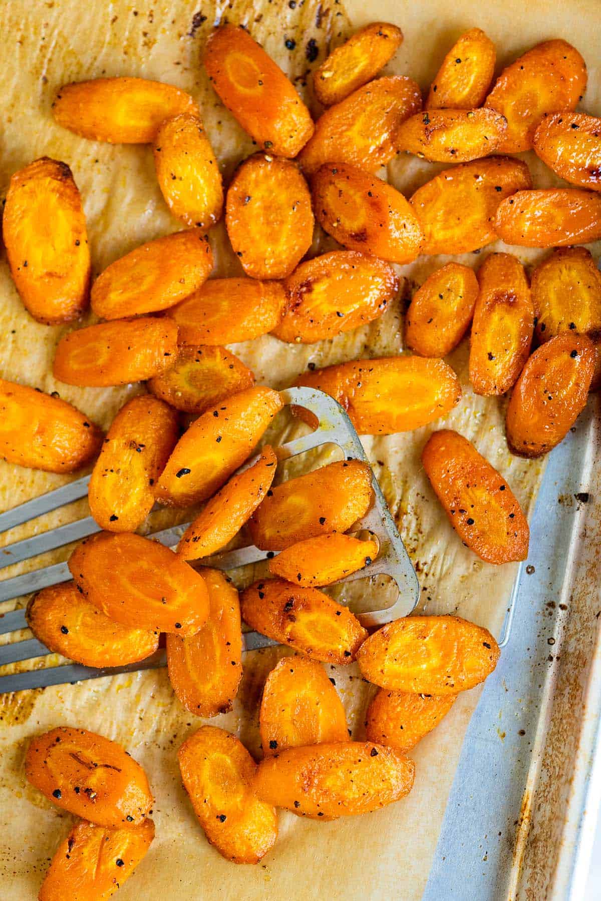 Roasted carrots on a baking sheet.