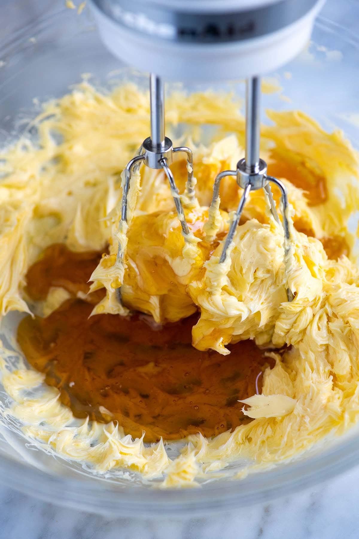 How to Make Honey Butter: Beating honey into the butter with an electric mixer