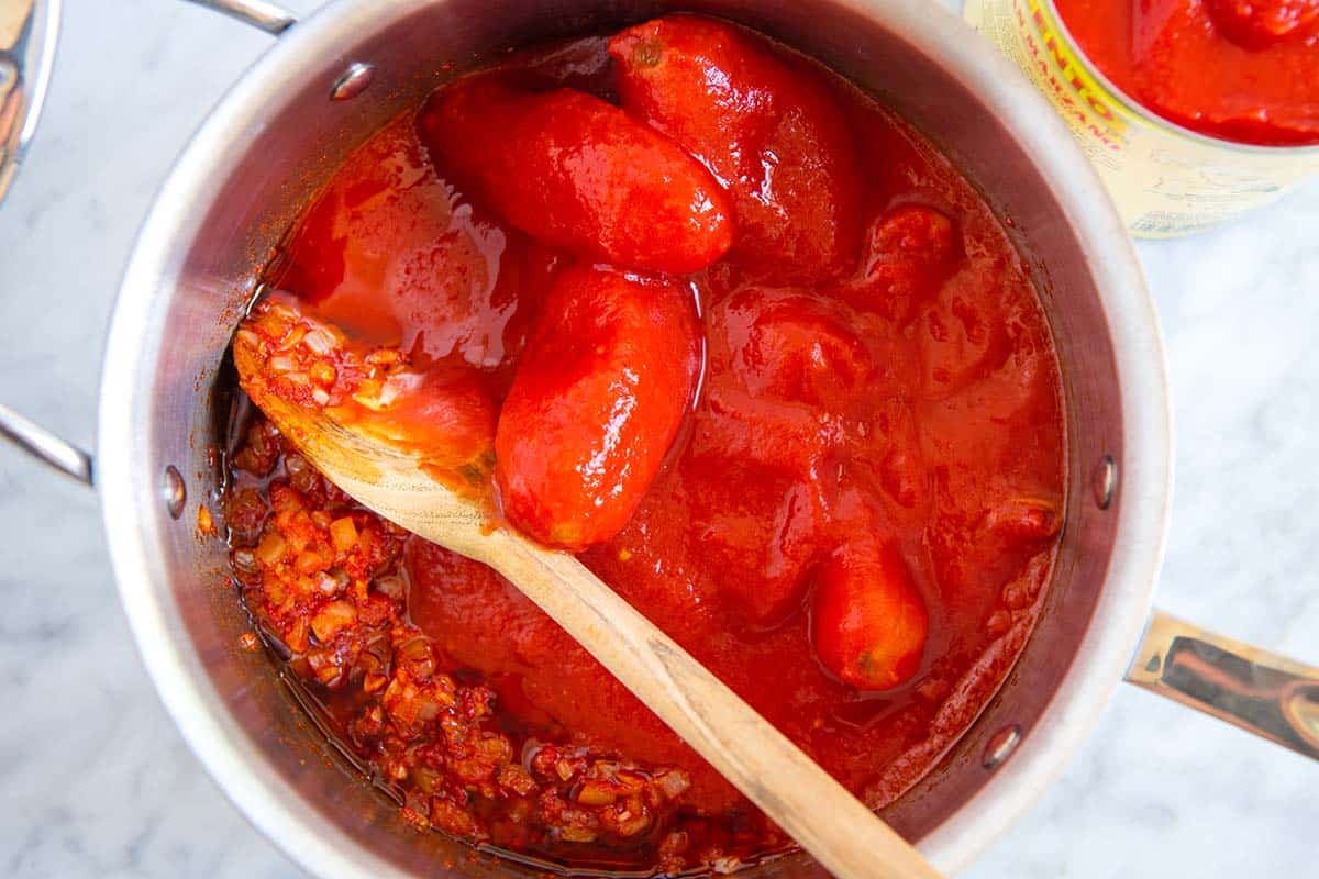 Making homemade pasta sauce with whole tomatoes