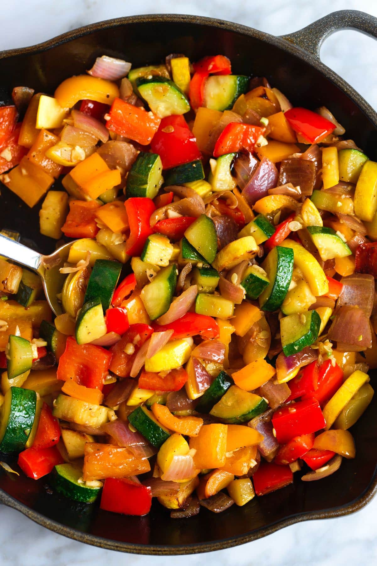 Sautéed veggies in a cast iron skillet