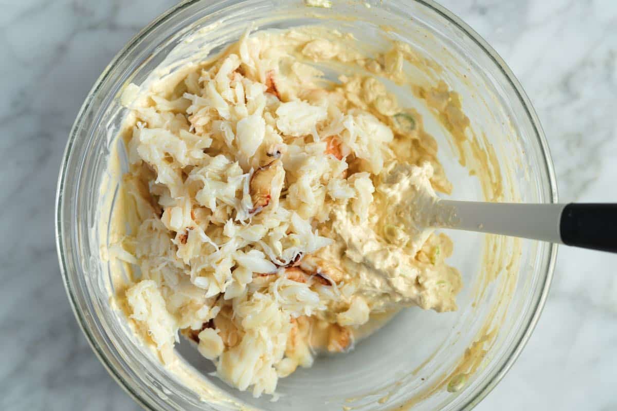 Folding crab meat into the rest of the dip ingredients