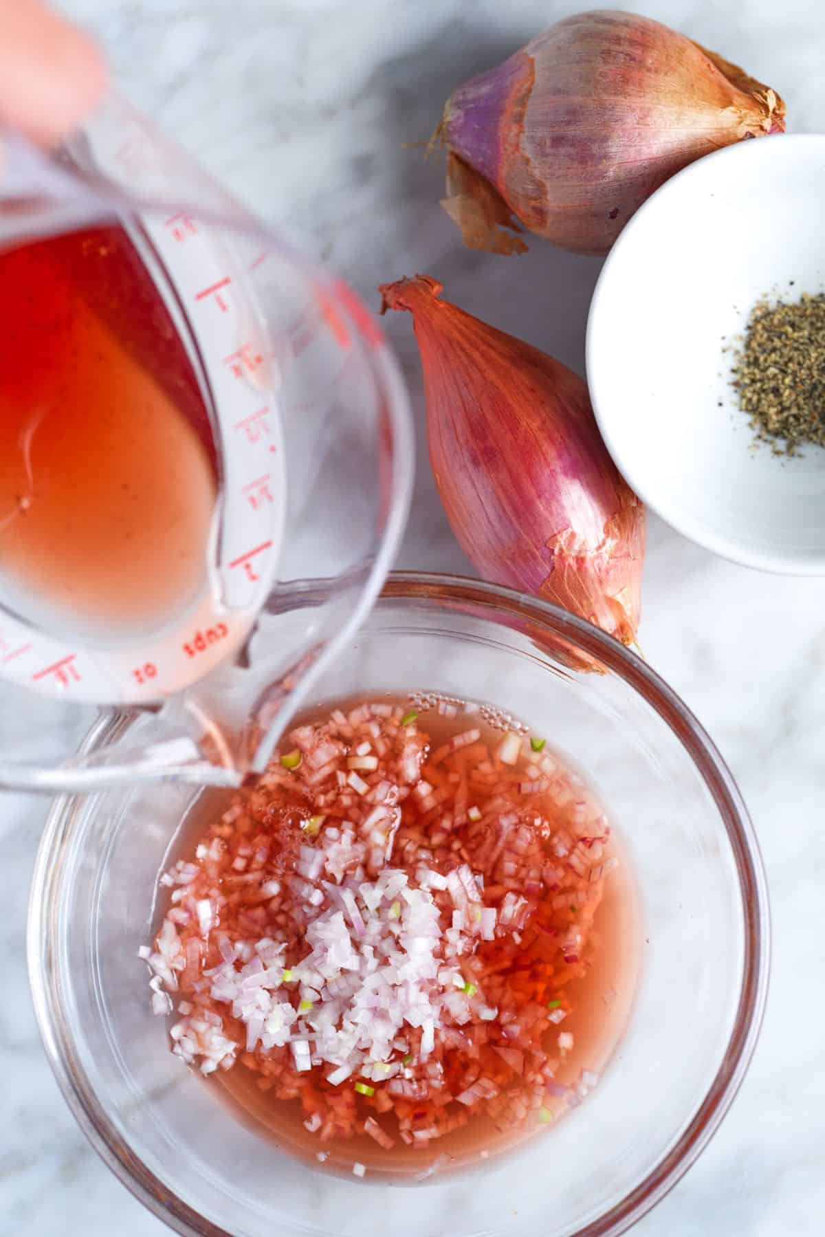 Making mignonette sauce for oysters