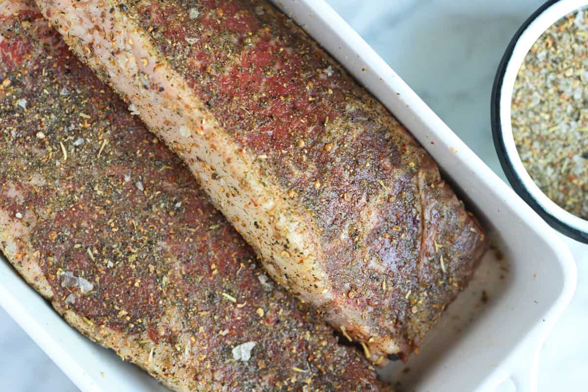 New York Steaks with steak seasoning getting ready for the grill