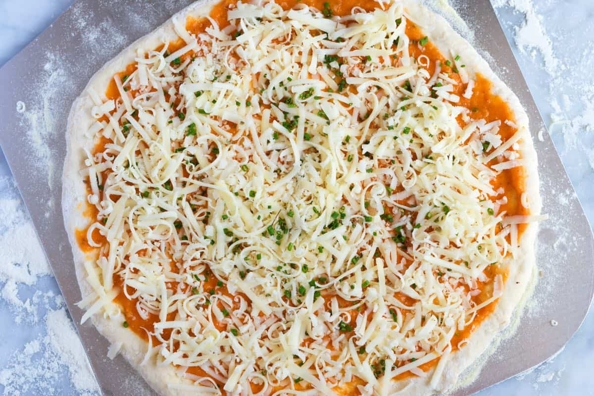 How to Make Cheese Pizza: Cheese pizza ready to be baked
