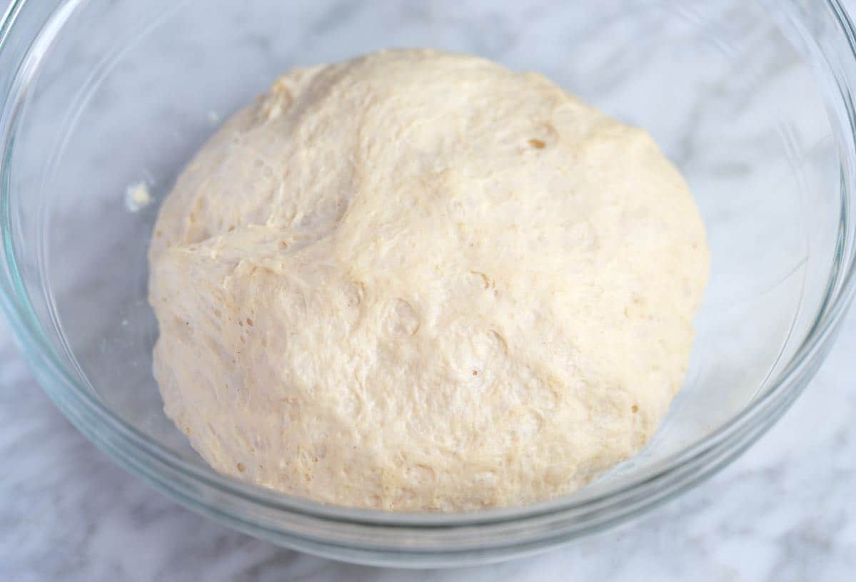 Proofed pizza dough ready to stretch and roll out.