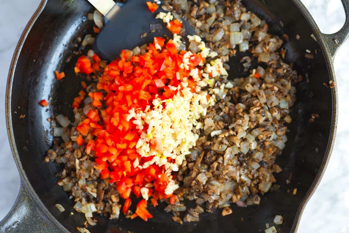 Cooking mushrooms, onion, and garlic until soft before adding the the meatloaf mixture.