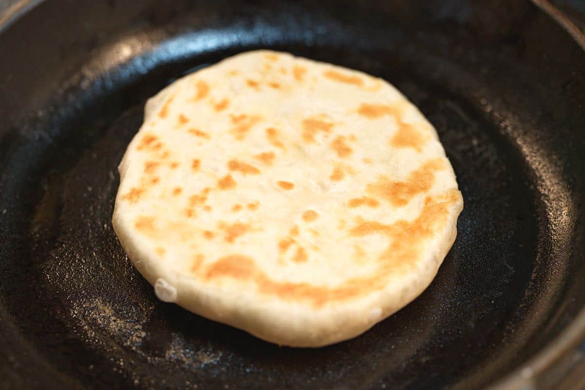 Cooking pita in skillet